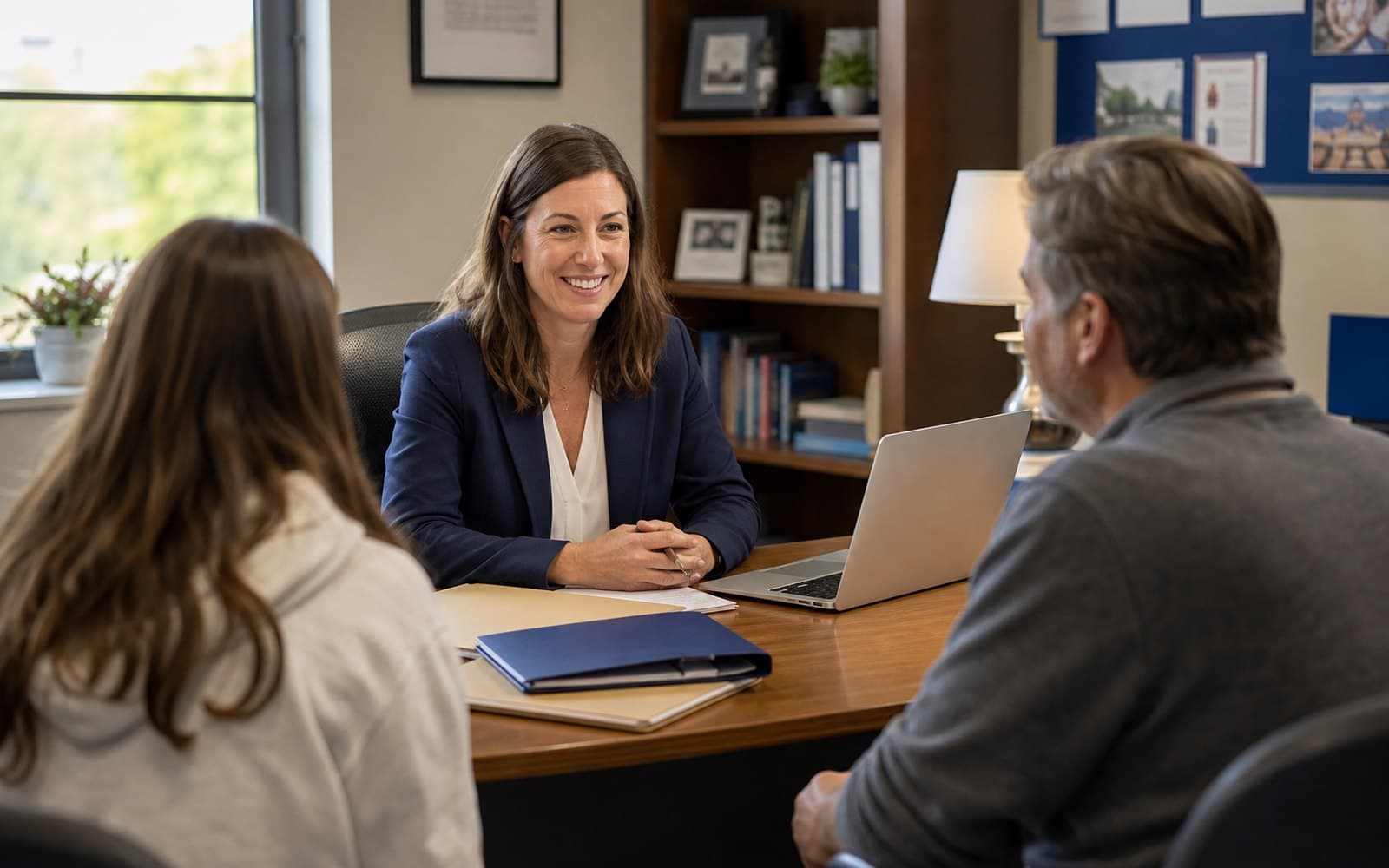 A St Paul High School counselor meeting with a student about college plans